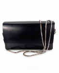 Front View with Chain: Onyx black smooth leather box clutch bag by SHUCLUB, featuring a structured rectangular design, a clean minimalist front flap, and a polished silver-tone snake chain strap draped across the front face. Side & Back Detail View: Side and reverse profile angle of the structured black SHUCLUB clutch bag, showcasing its architectural box shape, silver-tone side hardware attachments, and flat-head silver metal stud accents on the back.