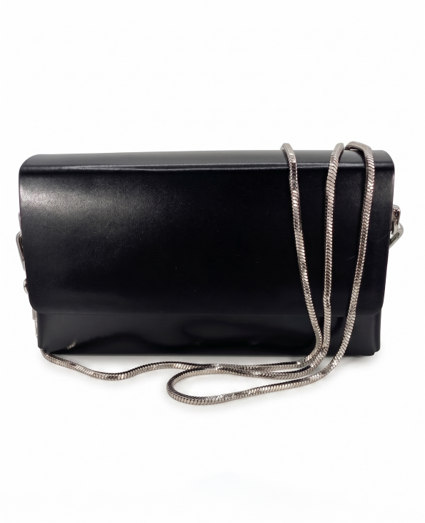 Front View with Chain: Onyx black smooth leather box clutch bag by SHUCLUB, featuring a structured rectangular design, a clean minimalist front flap, and a polished silver-tone snake chain strap draped across the front face. Side & Back Detail View: Side and reverse profile angle of the structured black SHUCLUB clutch bag, showcasing its architectural box shape, silver-tone side hardware attachments, and flat-head silver metal stud accents on the back.