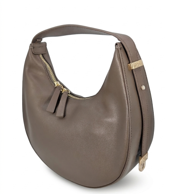 Taupe brown smooth leather crescent-shaped hobo shoulder bag by SHUCLUB, featuring a curved silhouette, dual gold-tone zipper pulls, an adjustable side strap with gold hardware accents, shot from multiple product angles on a clean white background.