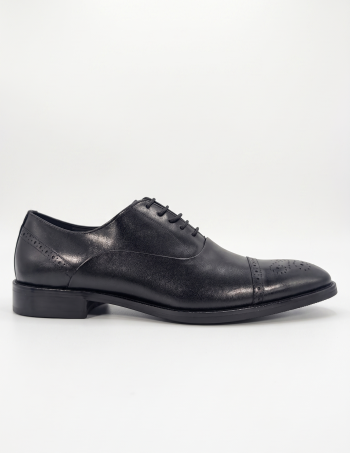 Side profile of a single black Shuclub leather Oxford shoe against a clean white background.