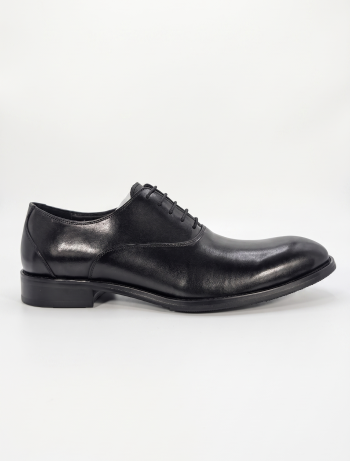 Rear view of the shoes highlighting the structured heel and high-quality leather stitching.