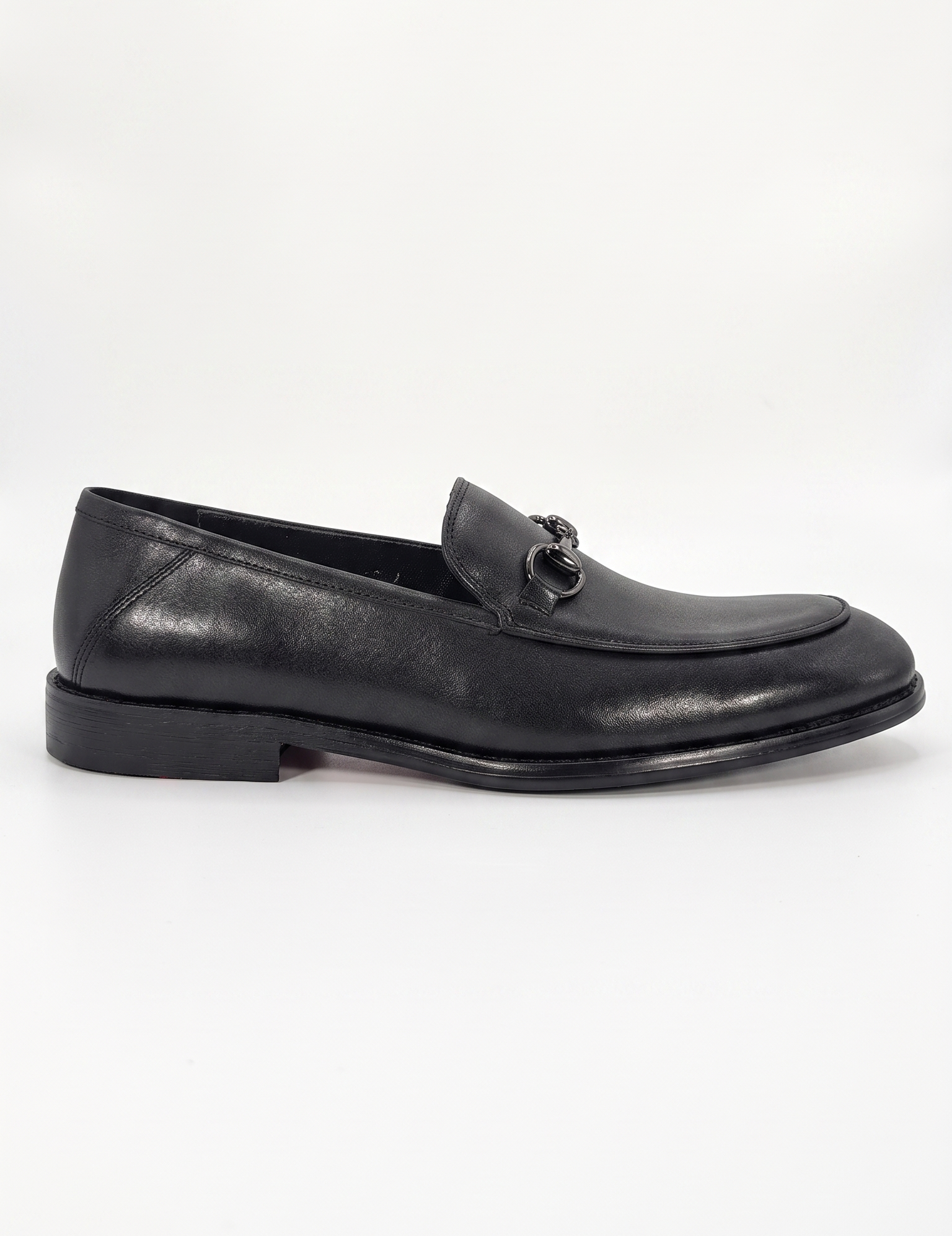 RIGHT Shuclub genuine leather loafers with red bottom soles.